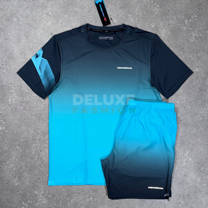 A two-piece athletic set consisting of a short-sleeve gradient t-shirt and matching shorts, laid flat on a gray concrete background. The t-shirt features a dark navy-to-turquoise gradient with a geometric pattern on the sleeve, and the shorts are solid turquoise-to-navy gradient.