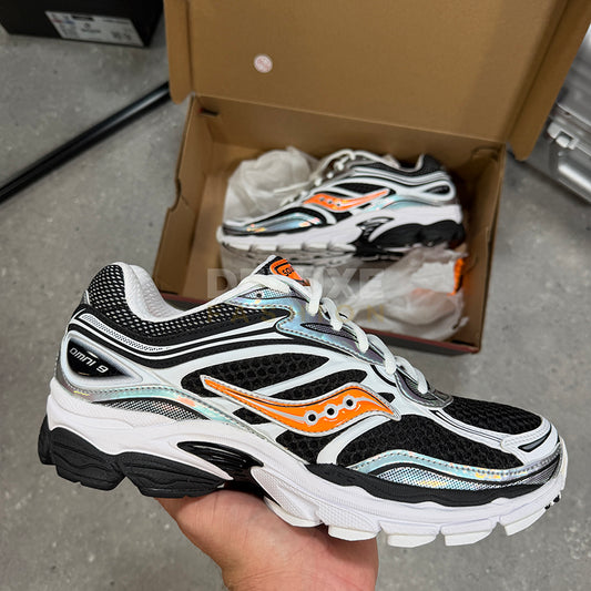 Saucony Pro trainers in black/orange